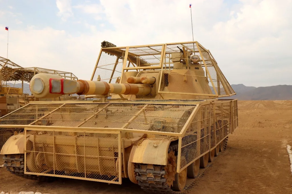 Бронеавтомобиль АСН 233115 «Тигр-М СпН» с станковым крупнокалиберным пулемётом ДШК в антидроновом скворечнике и дополнительным бронированием