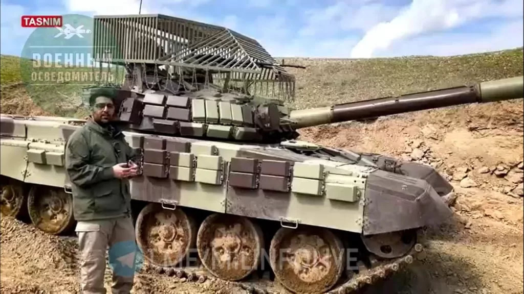 Иранский Т-72С с антидроновым козырьком, спроектированным явно под влиянием аналогичной еще предвоенной российской конструкции