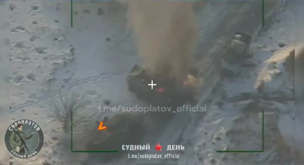 Кадры поражения бронетранспортёра M1117 ВСУ, который пытался эвакуировать другой застрявший и брошенный M1117, также поражённый дроном